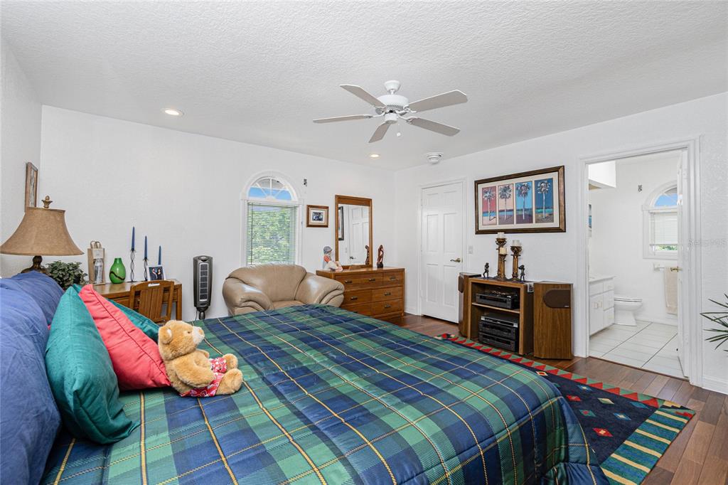 202 George Road Southeast Port Charlotte, FL 33952 - Photo 43 of 100 a bedroom with two beds and painting on the wall