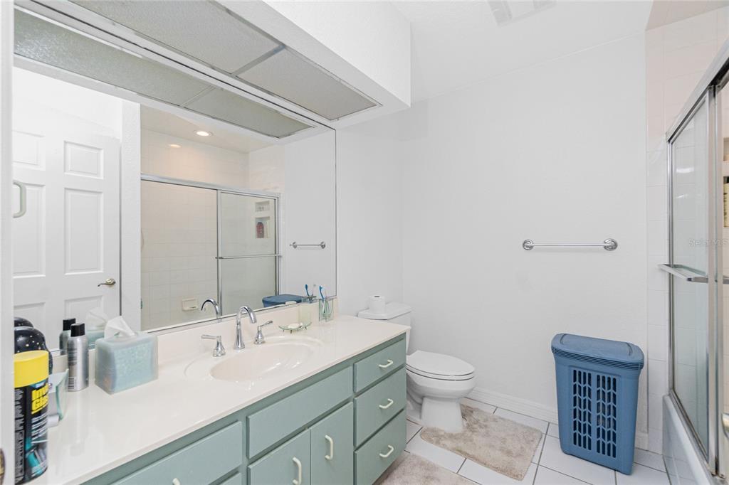 202 George Road Southeast Port Charlotte, FL 33952 - Photo 52 of 100 a bathroom with a granite countertop sink a toilet and a mirror