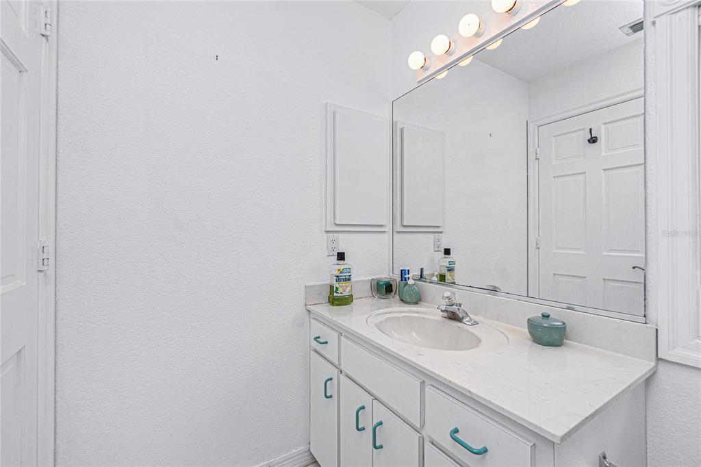 202 George Road Southeast Port Charlotte, FL 33952 - Photo 63 of 100 a bathroom with a sink and a mirror