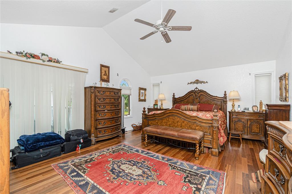 202 George Road Southeast Port Charlotte, FL 33952 - Photo 67 of 100 a bedroom with furniture and a wooden floor