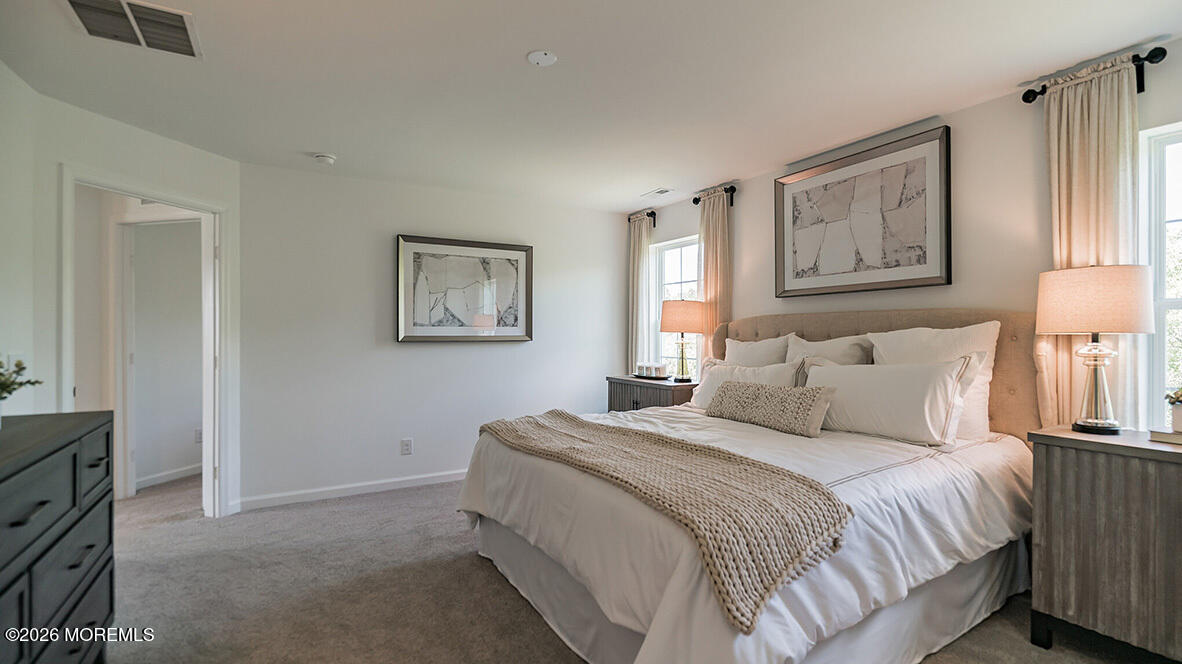 48 East 3rd Street Howell, NJ 07731 - Photo 13 of 20 a bedroom with bed and painting on the wall