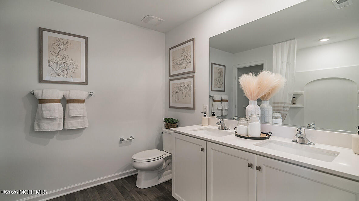 48 East 3rd Street Howell, NJ 07731 - Photo 15 of 20 a bathroom with a toilet sink and mirror