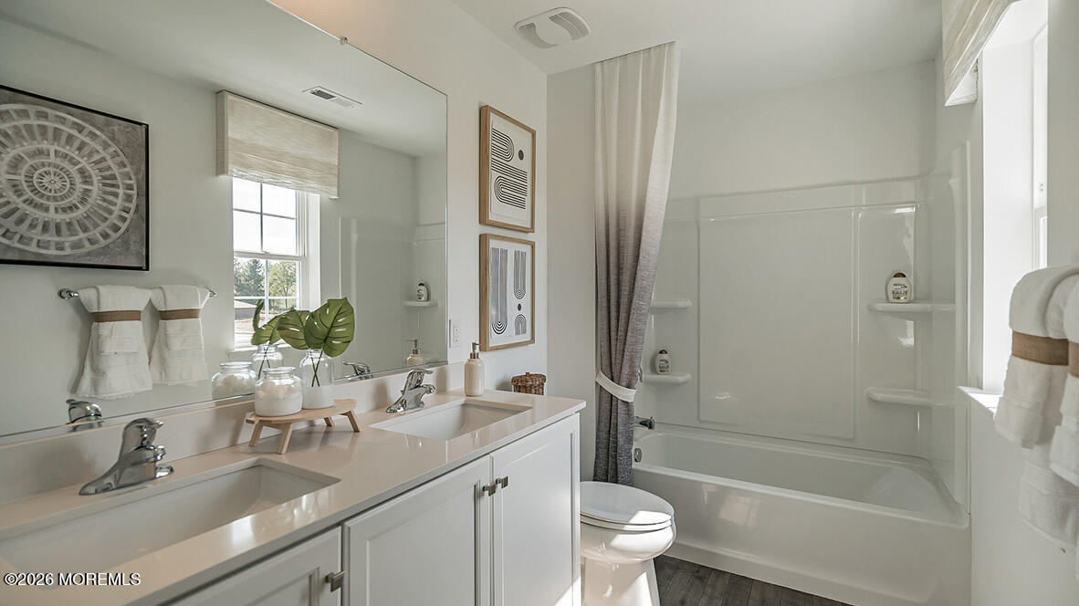 48 East 3rd Street Howell, NJ 07731 - Photo 20 of 20 a bathroom with a granite countertop sink toilet and shower