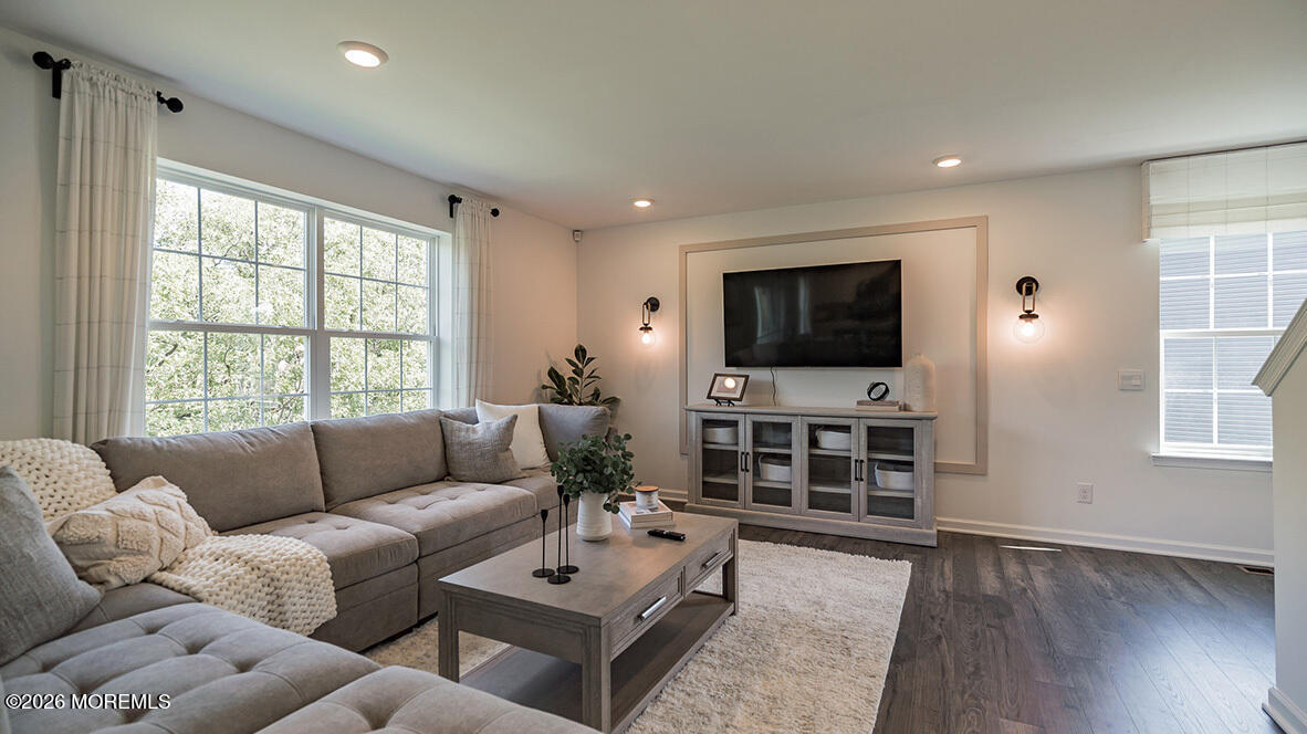 48 East 3rd Street Howell, NJ 07731 - Photo 8 of 20 a living room with furniture and a flat screen tv