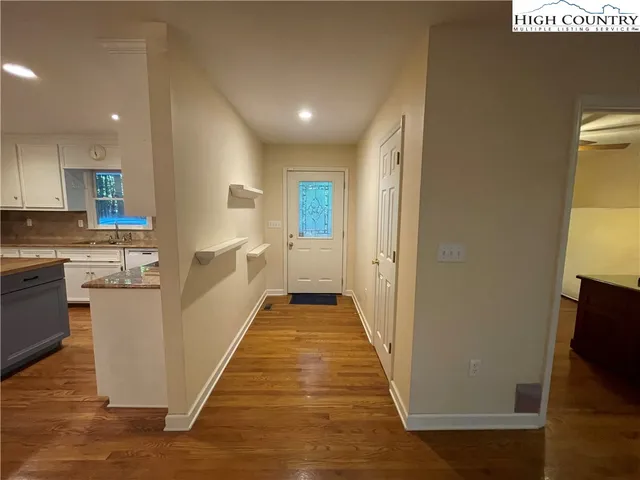 a view of a kitchen from the hallway
