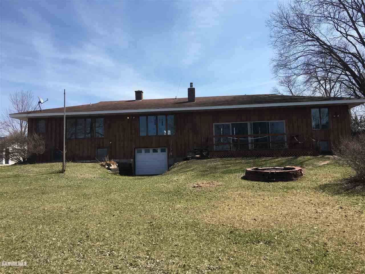 5694 Riverview Road Thomson, IL 61285 - Photo 3 of 25 a view of a house with backyard and a garden