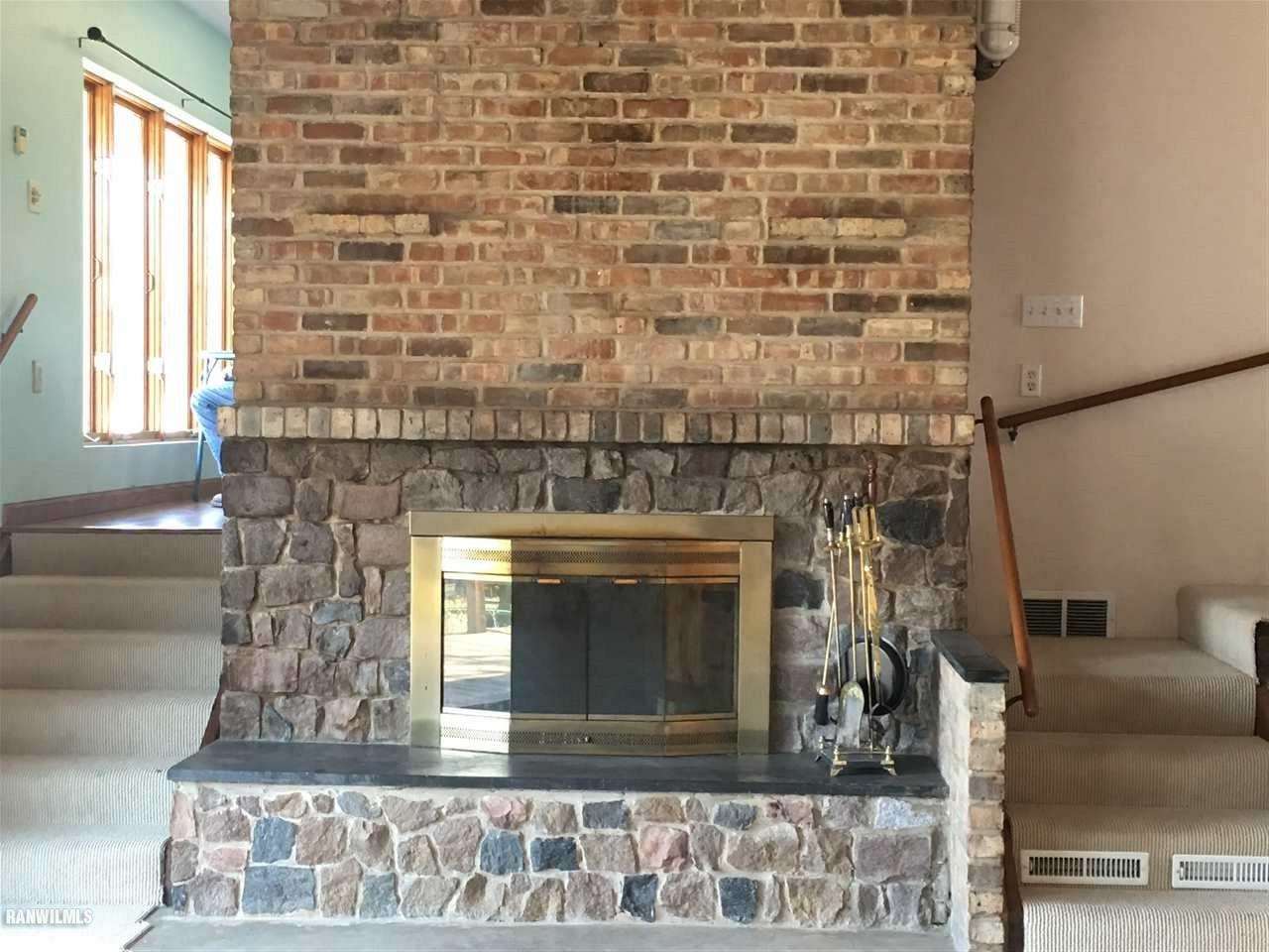 5694 Riverview Road Thomson, IL 61285 - Photo 7 of 25 a living room with a fireplace