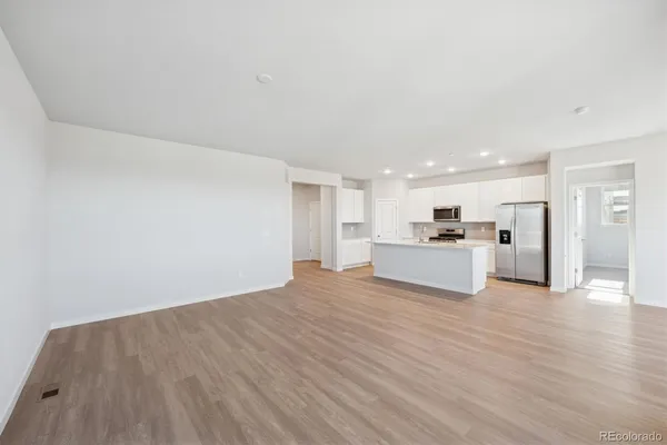 a view of kitchen livingroom with wooden floor