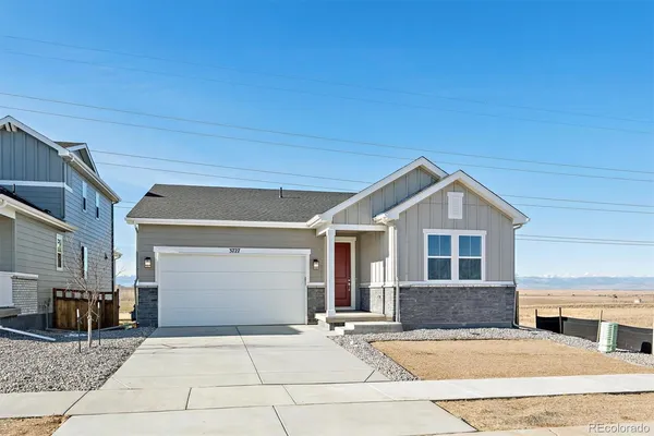 a front view of a house with yard