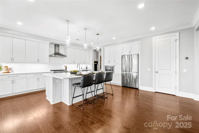 a bathroom with a granite countertop sink mirror and window