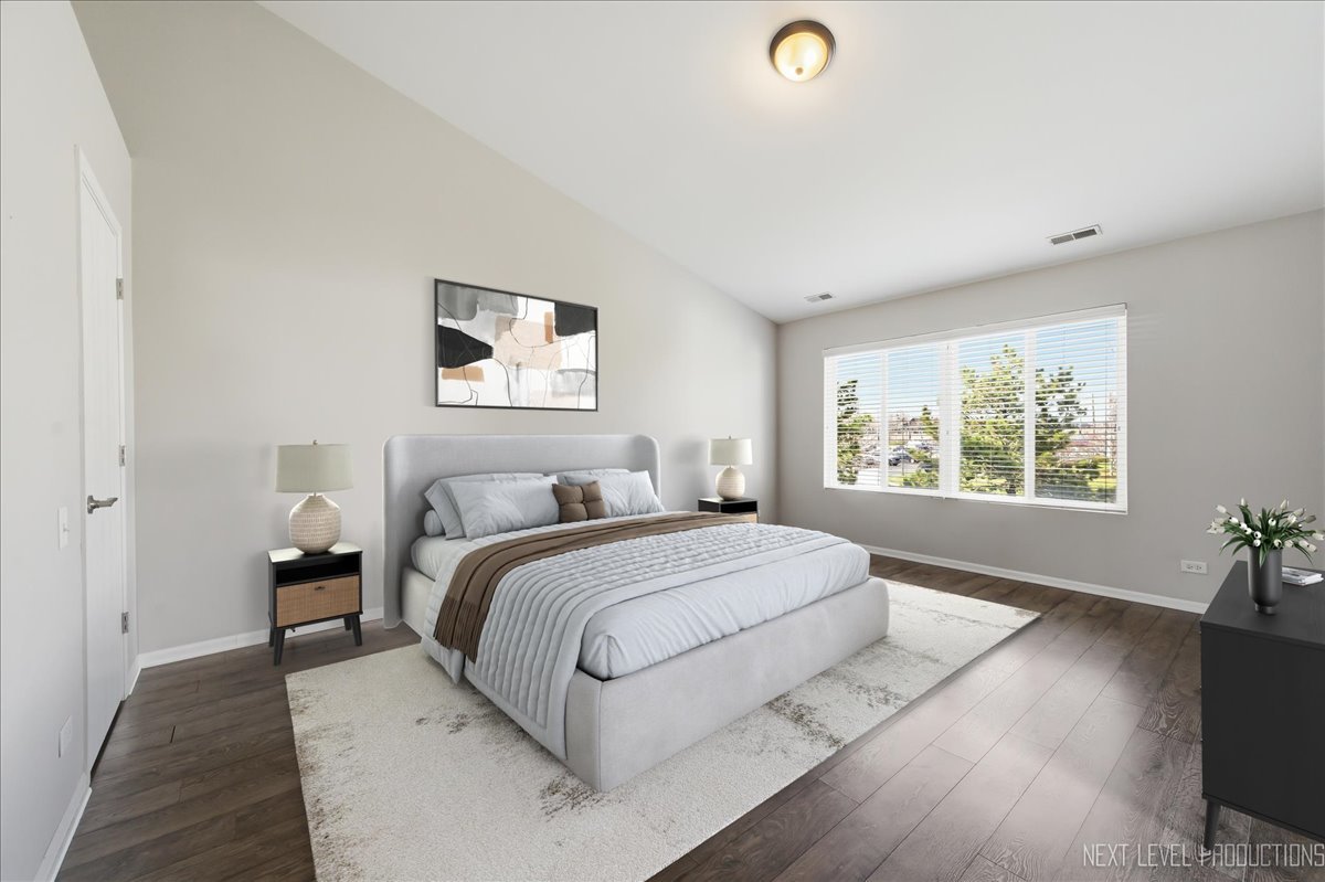 1102 Delta Drive, Unit 1102 Elgin, IL 60123 - Photo 16 of 29 a spacious bedroom with a large bed and a window