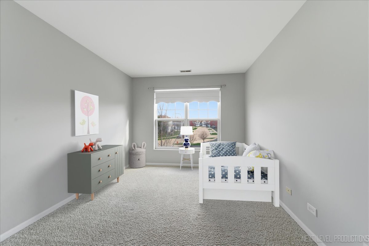 1102 Delta Drive, Unit 1102 Elgin, IL 60123 - Photo 21 of 29 a bedroom with furniture and window