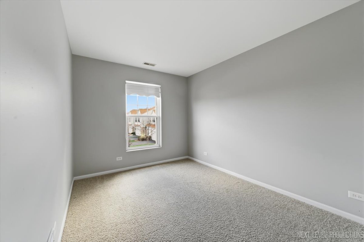 1102 Delta Drive, Unit 1102 Elgin, IL 60123 - Photo 24 of 29 an empty room with a window