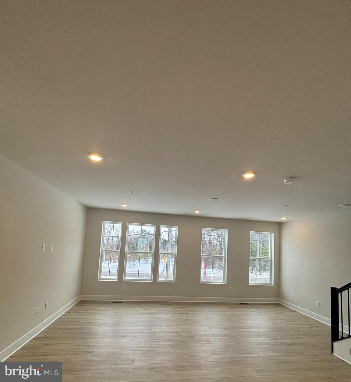 7234 Contee Road Laurel, MD 20707 - Photo 4 of 9 a view of empty room with wooden floor and fan