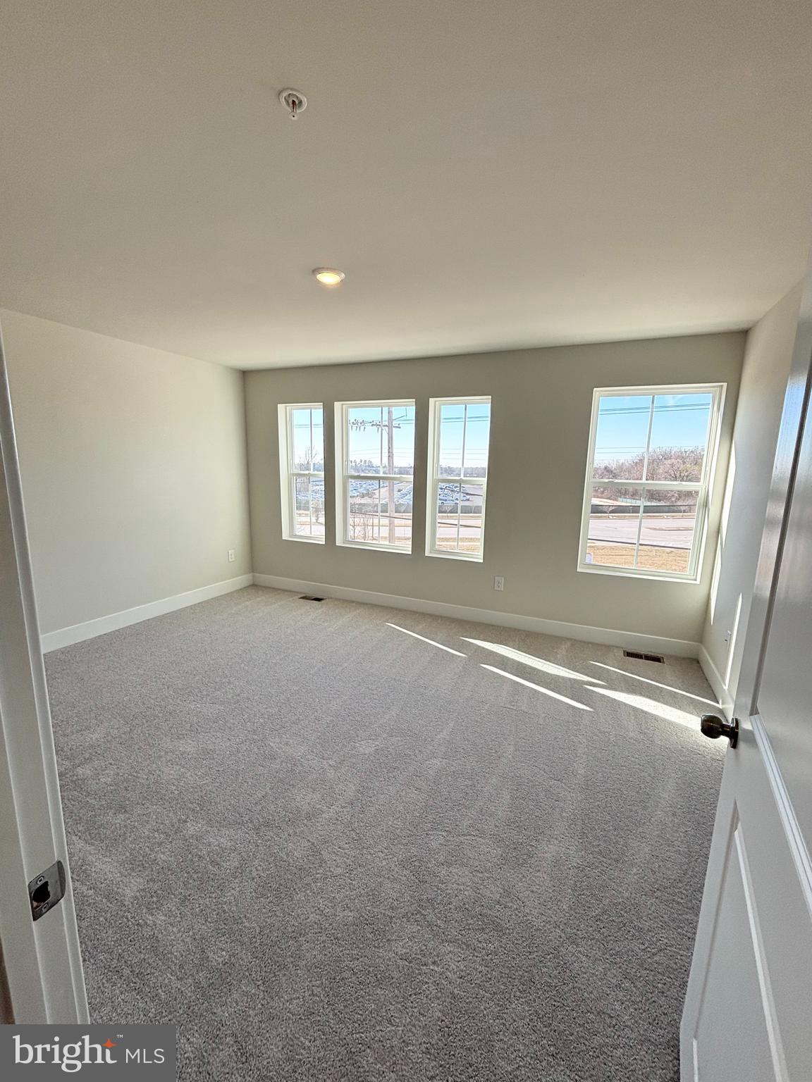 7234 Contee Road Laurel, MD 20707 - Photo 5 of 9 a view of an empty room with a window