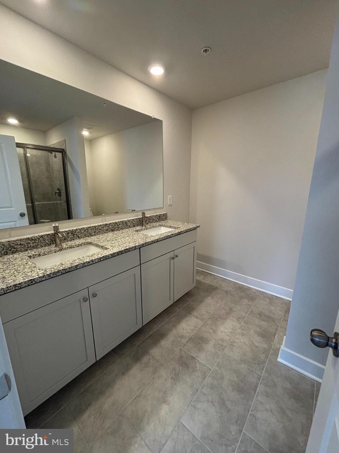 7234 Contee Road Laurel, MD 20707 - Photo 6 of 9 a bathroom with a sink and a mirror