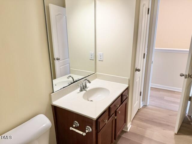8227 Primanti Boulevard Raleigh, NC 27612 - Photo 21 of 25 a bathroom with a sink and a mirror