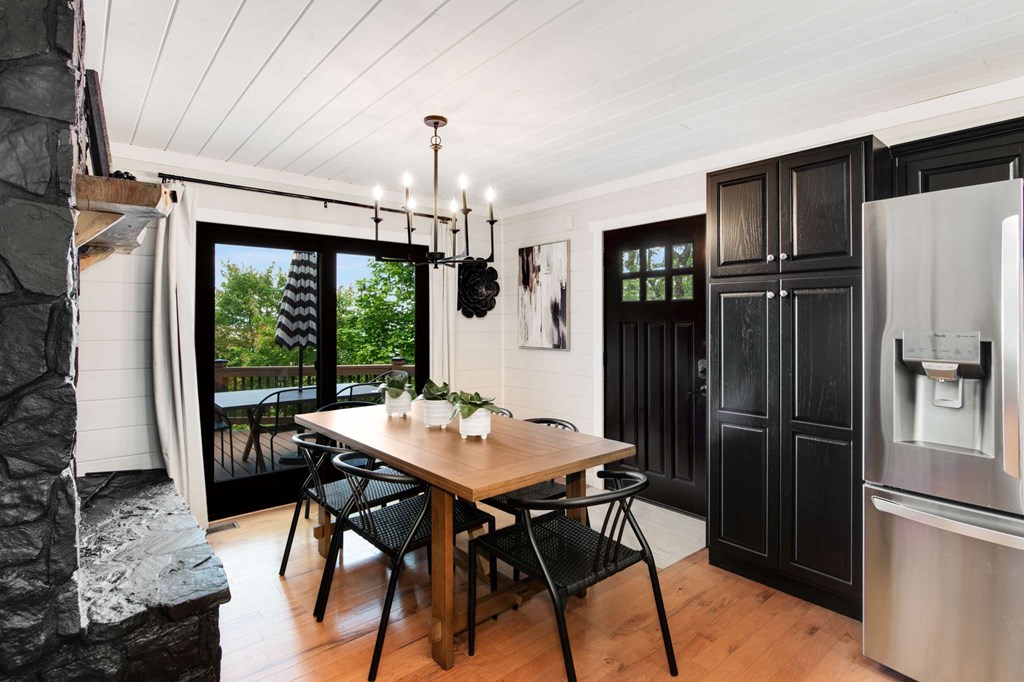 231 Sunrock Mountain Trail Blue Ridge, GA 30513 - Photo 13 of 61 a view of a dining room with furniture window and wooden floor