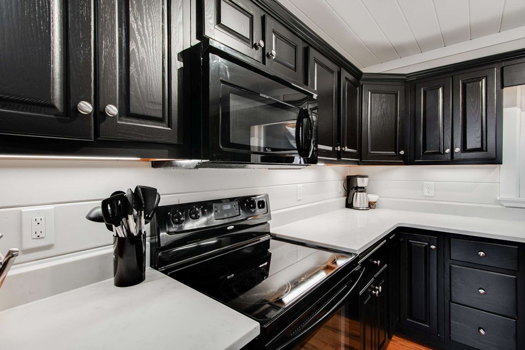 231 Sunrock Mountain Trail Blue Ridge, GA 30513 - Photo 18 of 61 a kitchen with sink a stove and cabinets