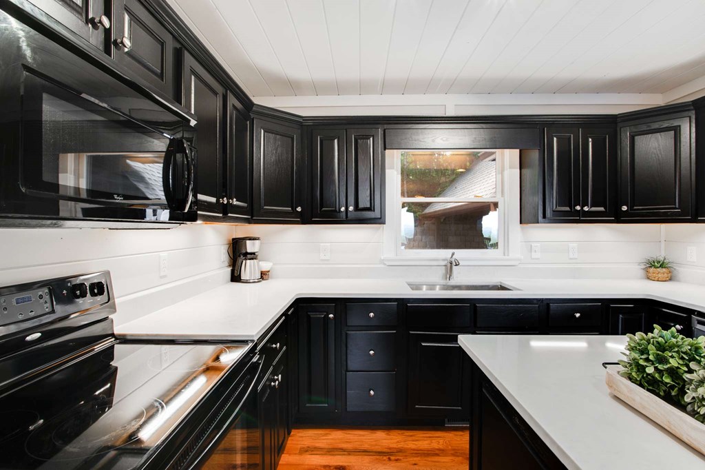 231 Sunrock Mountain Trail Blue Ridge, GA 30513 - Photo 19 of 61 a kitchen with a sink and a stove top oven