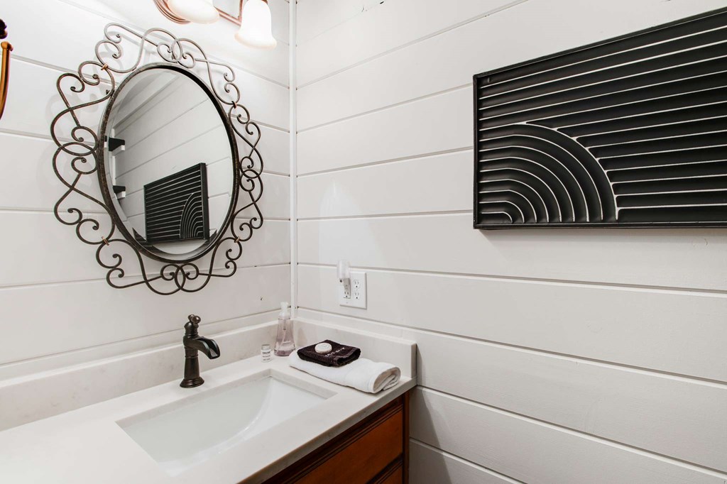 231 Sunrock Mountain Trail Blue Ridge, GA 30513 - Photo 21 of 61 a bathroom with a sink and a mirror
