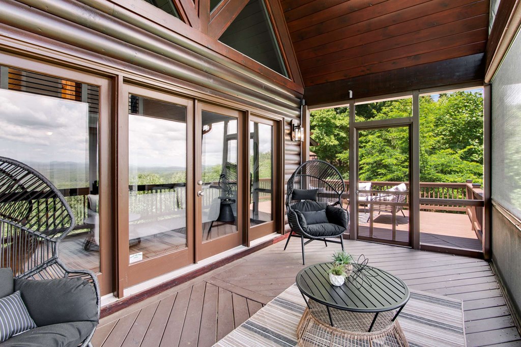 231 Sunrock Mountain Trail Blue Ridge, GA 30513 - Photo 22 of 61 a living room with furniture and a large window