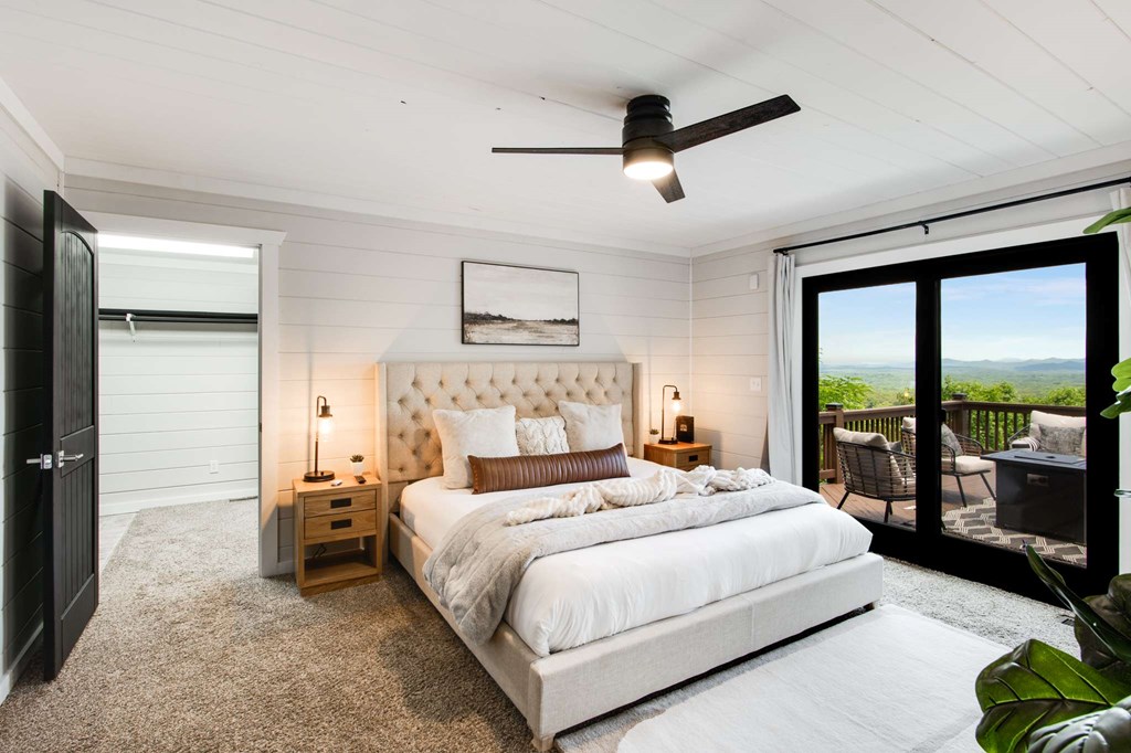 231 Sunrock Mountain Trail Blue Ridge, GA 30513 - Photo 28 of 61 a bedroom with a large bed and a large window