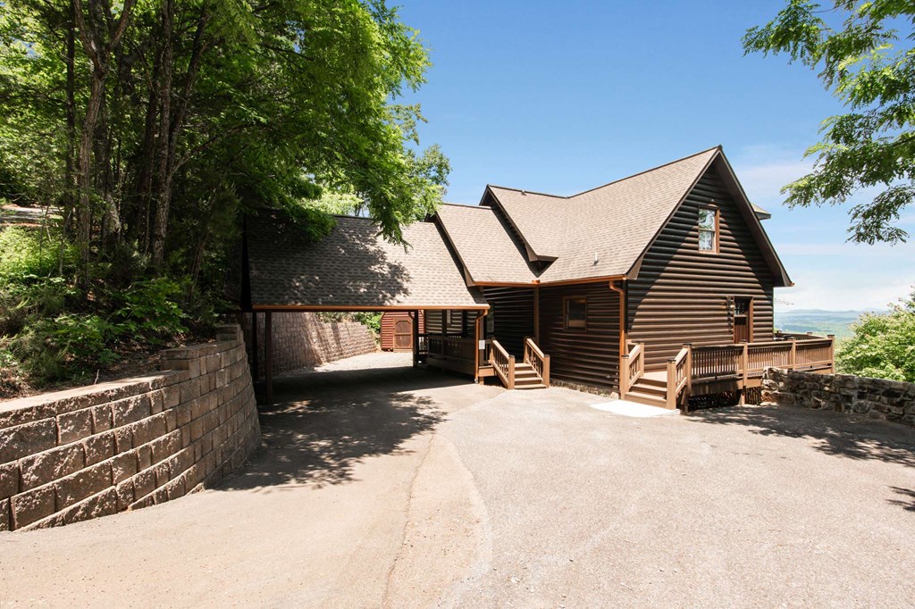 231 Sunrock Mountain Trail Blue Ridge, GA 30513 - Photo 3 of 61 a view of a house with backyard and sitting area