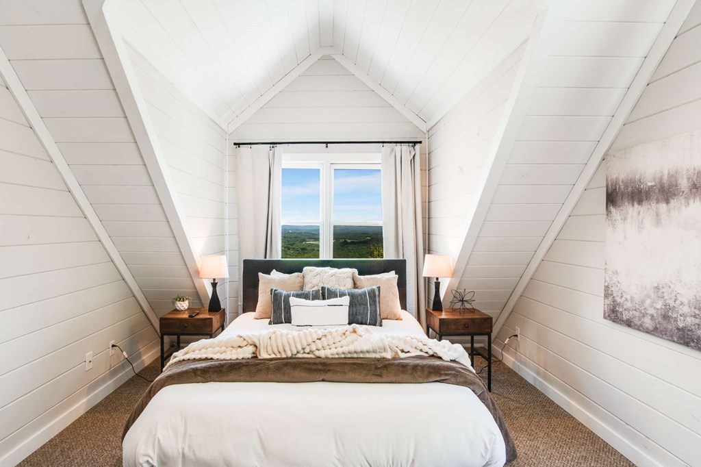 231 Sunrock Mountain Trail Blue Ridge, GA 30513 - Photo 38 of 61 a bedroom with a bed and a large window