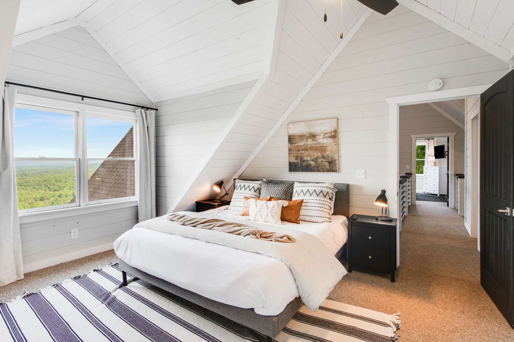 231 Sunrock Mountain Trail Blue Ridge, GA 30513 - Photo 41 of 61 a bedroom with a bed and wooden floor