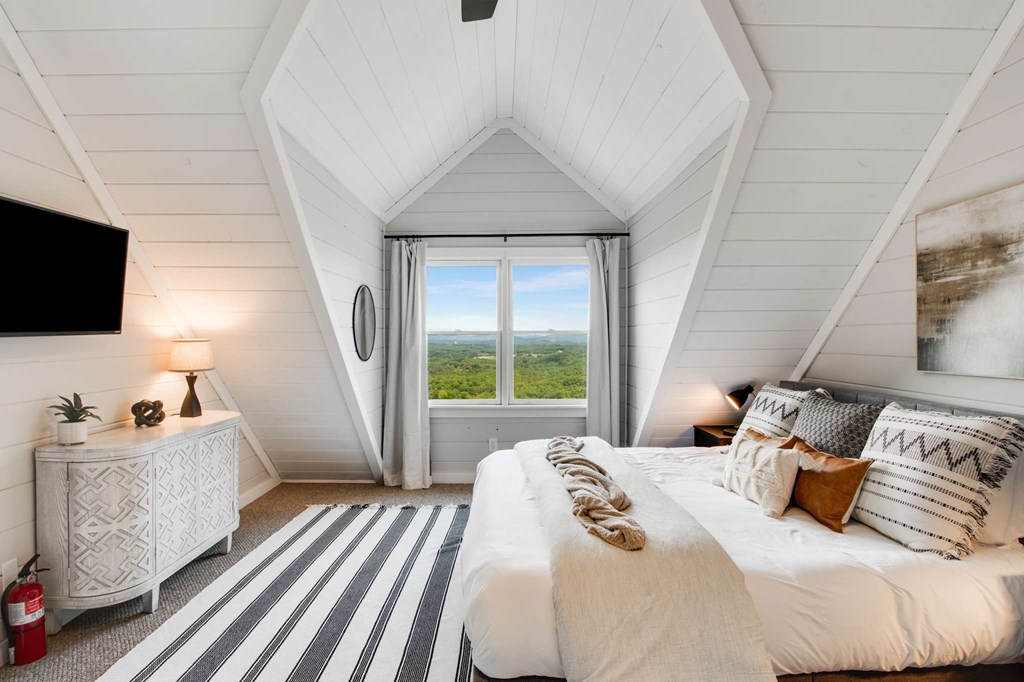 231 Sunrock Mountain Trail Blue Ridge, GA 30513 - Photo 42 of 61 a bedroom with a bed and flat screen tv