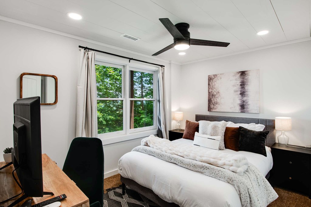 231 Sunrock Mountain Trail Blue Ridge, GA 30513 - Photo 45 of 61 a bedroom with a bed a window and a desk