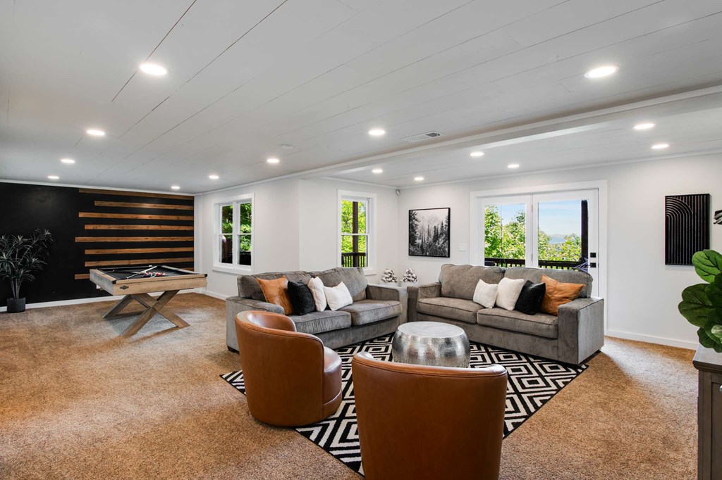 231 Sunrock Mountain Trail Blue Ridge, GA 30513 - Photo 46 of 61 a living room with furniture a air conditioner and a flat screen tv