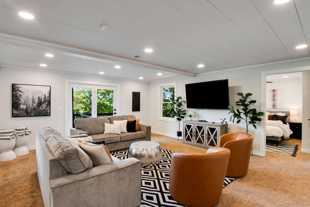 231 Sunrock Mountain Trail Blue Ridge, GA 30513 - Photo 48 of 61 a living room with furniture and a flat screen tv