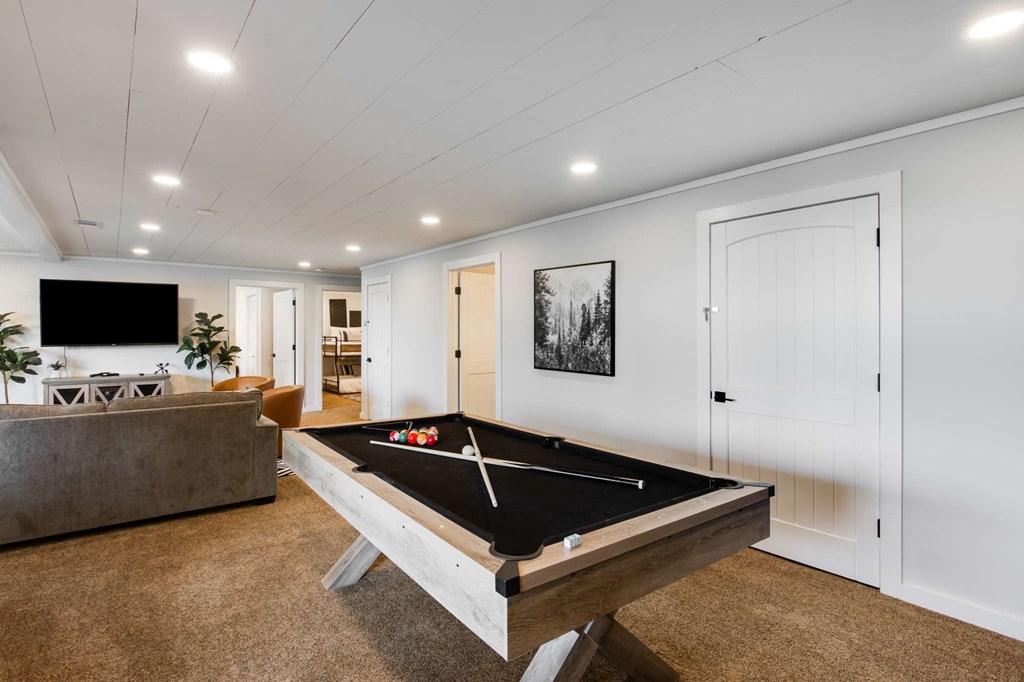 231 Sunrock Mountain Trail Blue Ridge, GA 30513 - Photo 51 of 61 a living room with furniture and a flat screen tv