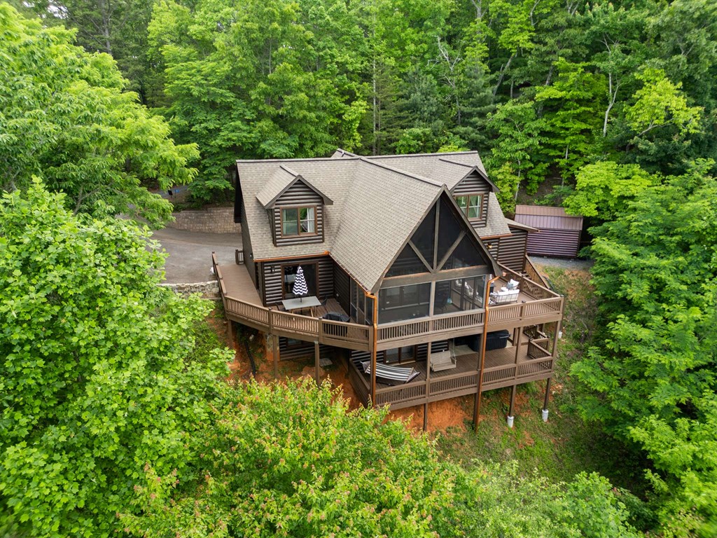 231 Sunrock Mountain Trail Blue Ridge, GA 30513 - Photo 57 of 61 an aerial view of a house with roof deck front table and chairs