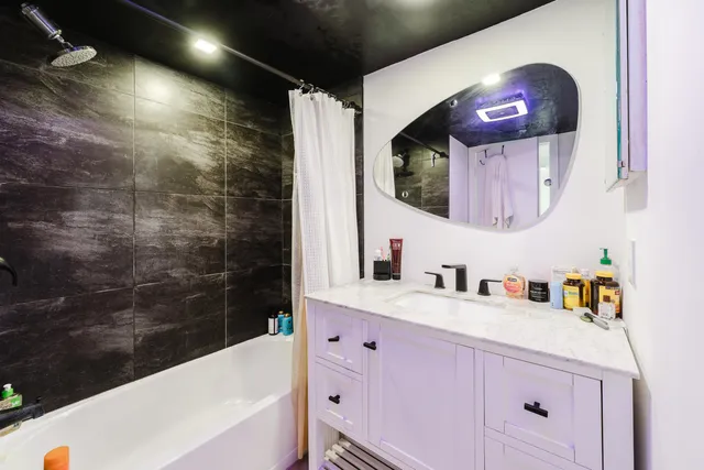 a bathroom with a sink and a mirror