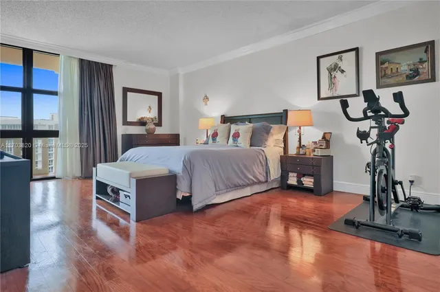 a view of a street with a bench in front of it