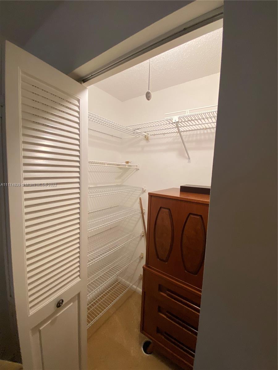 4034 Rexford B, Unit 4034 Boca Raton, FL 33434 - Photo 11 of 15 a close view of a sink and a dishwasher in a bathroom