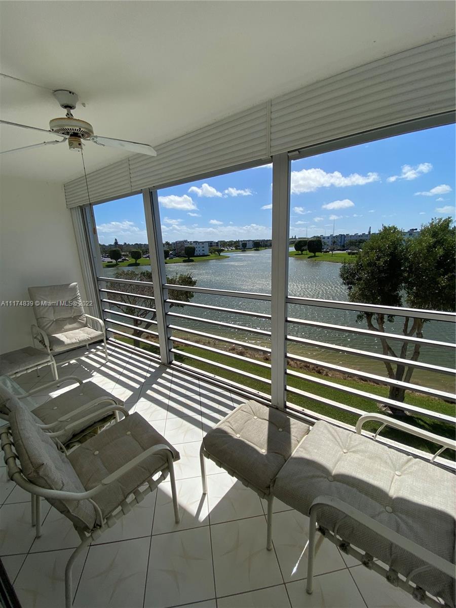 4034 Rexford B, Unit 4034 Boca Raton, FL 33434 - Photo 14 of 15 a view of a balcony with chairs