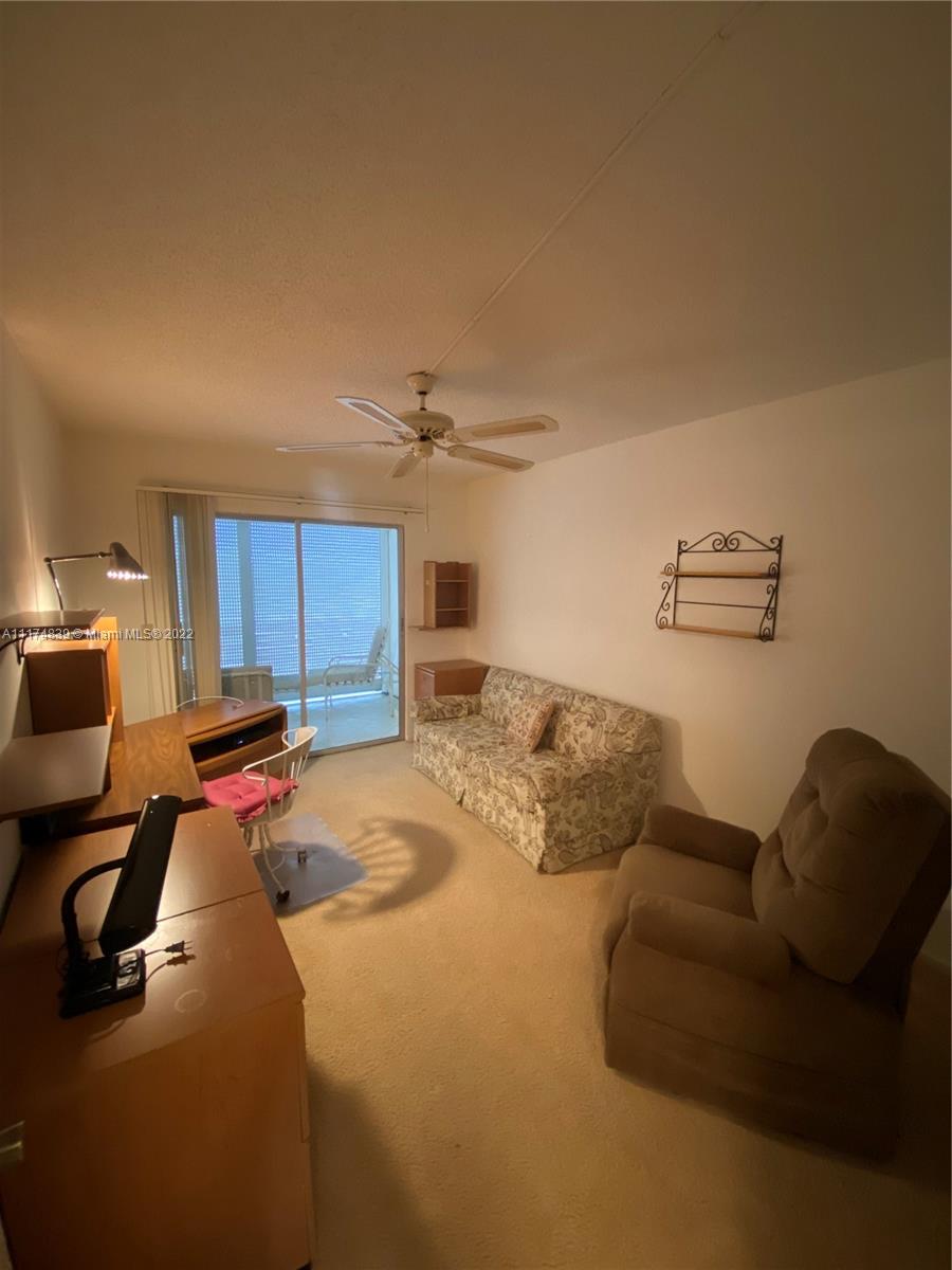 4034 Rexford B, Unit 4034 Boca Raton, FL 33434 - Photo 10 of 15 a bedroom with a bed and furniture