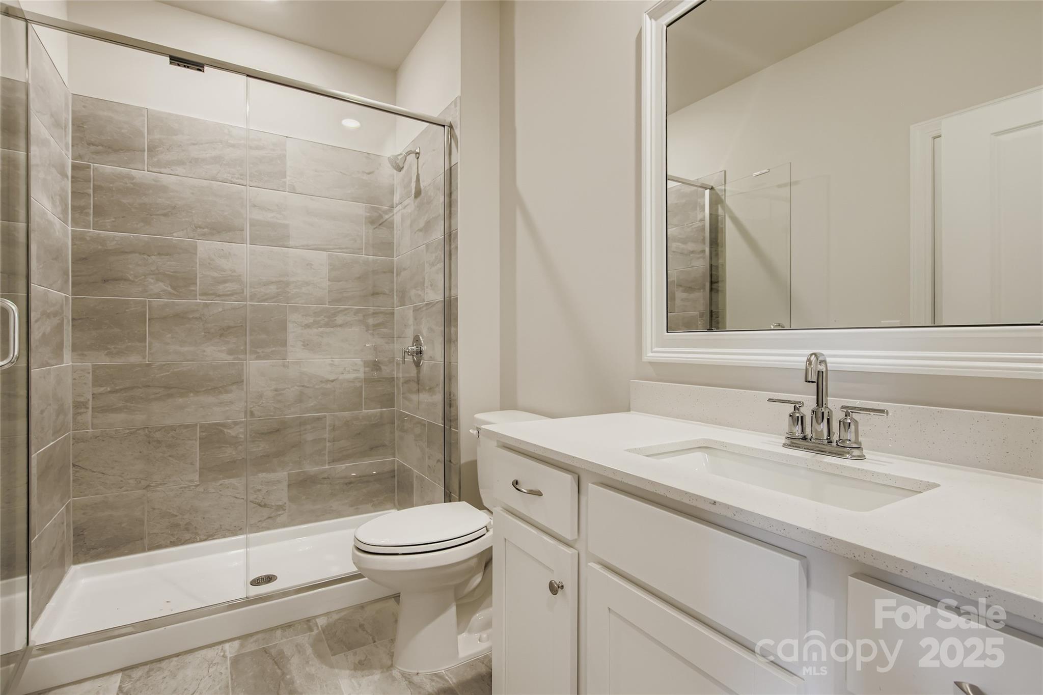 2238 Moon Crst Road Lancaster, SC 29720 - Photo 11 of 16 a bathroom with a sink a toilet and shower