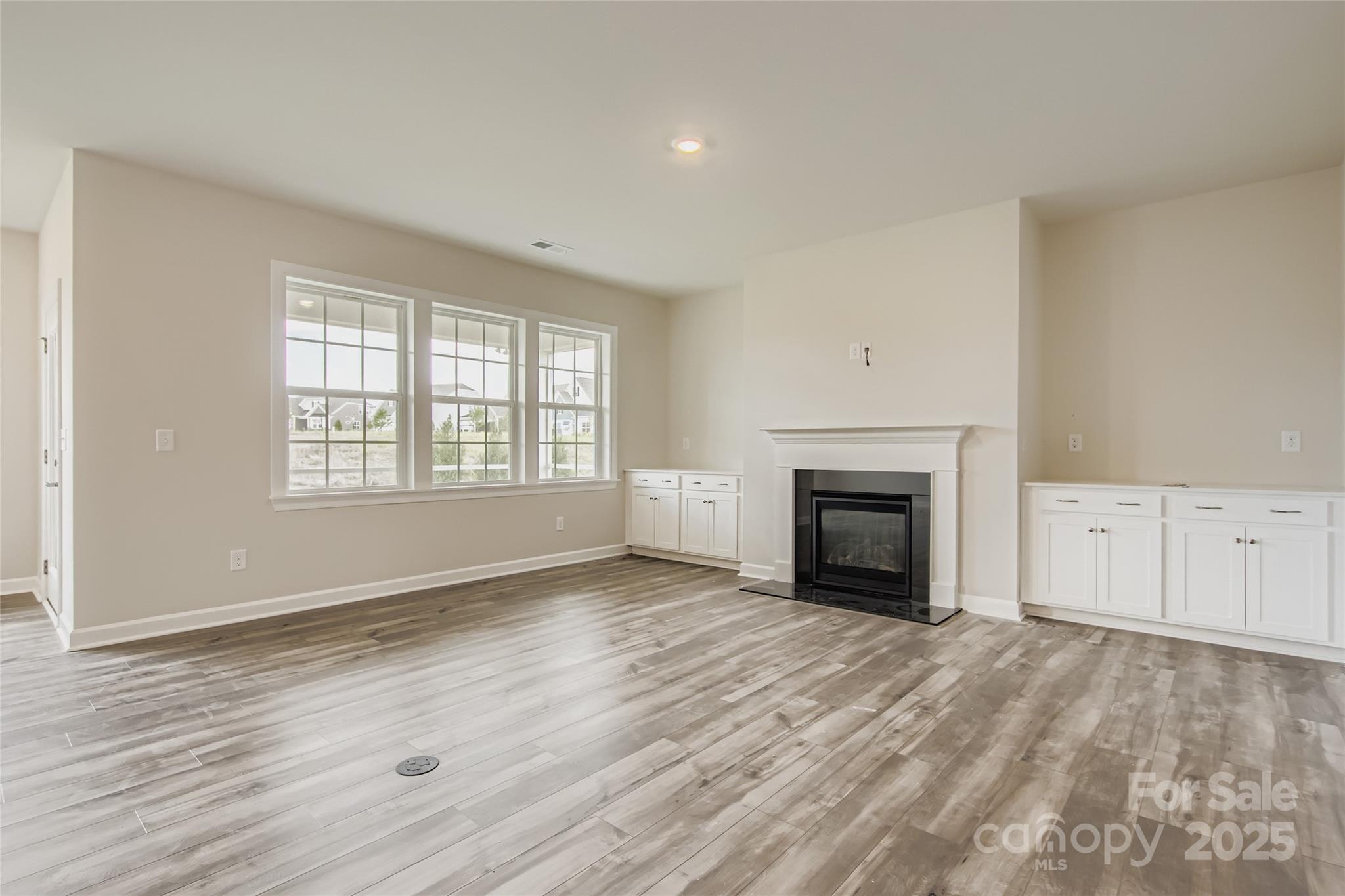 2238 Moon Crst Road Lancaster, SC 29720 - Photo 4 of 16 wooden floor fireplace and windows in an empty room