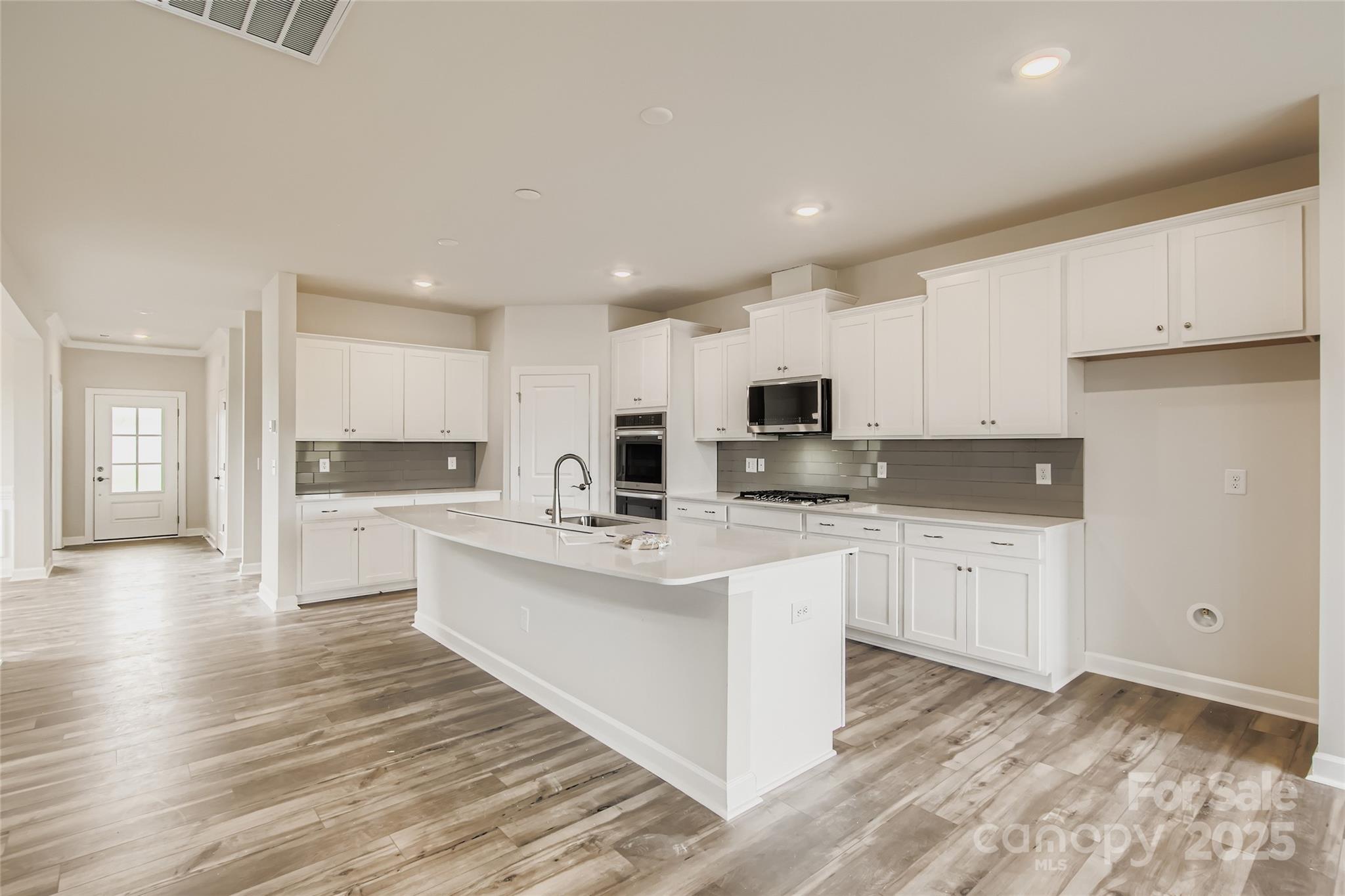 2238 Moon Crst Road Lancaster, SC 29720 - Photo 6 of 16 a kitchen with white cabinets appliances and sink
