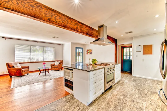 a very nice looking living room with a large window
