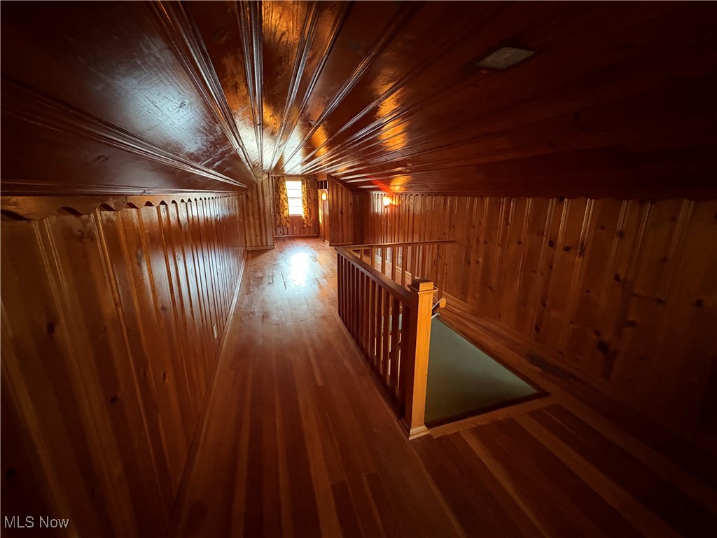 9801 Clay Pike Road Byesville, OH 43723 - Photo 22 of 27 Additional living space featuring wood ceiling, wood walls, and hardwood / wood-style flooring