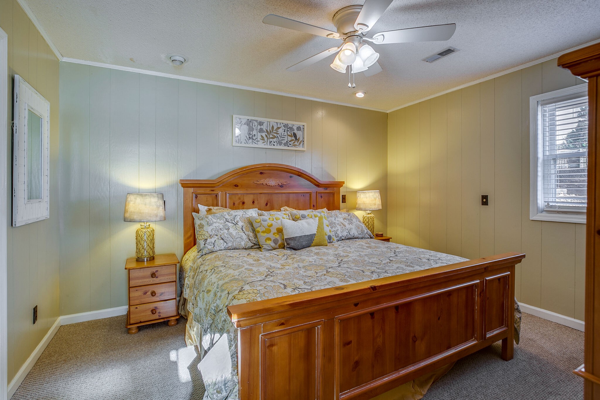 175 Holly Tree Drive Estill Springs, TN 37330 - Photo 24 of 38 a bedroom with a bed and a chandelier