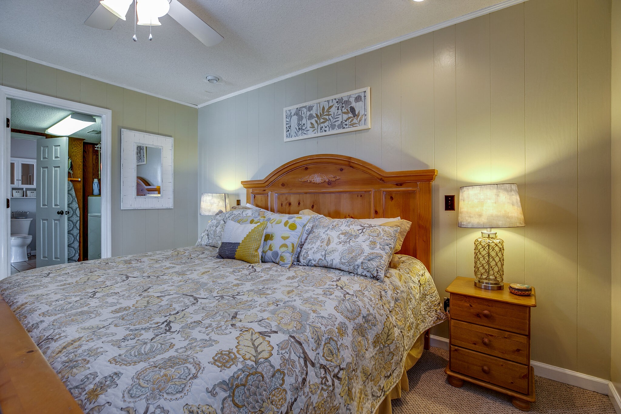 175 Holly Tree Drive Estill Springs, TN 37330 - Photo 25 of 38 a bedroom with a bed and a lamp on dresser