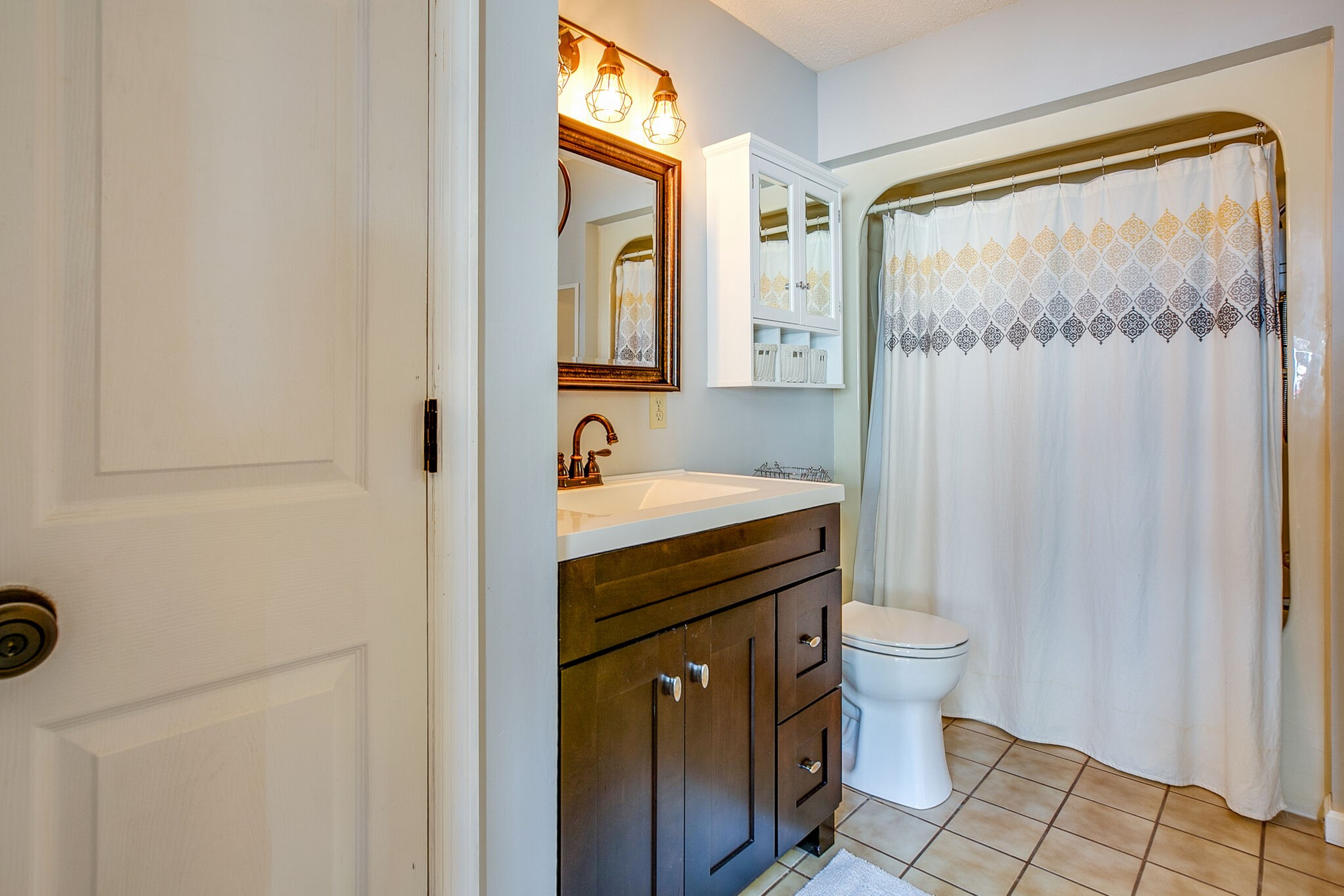 175 Holly Tree Drive Estill Springs, TN 37330 - Photo 27 of 38 a bathroom with a sink a toilet and shower