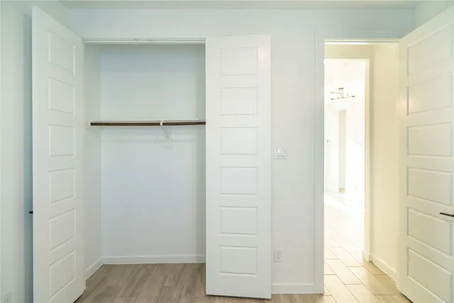 a bathroom with a double vanity sink mirror and toilet